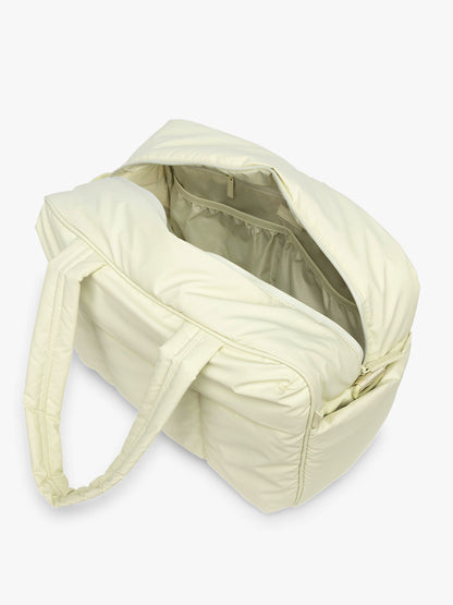 Opened CALPAK Luka Duffel in light green Celadon; DSM1901-CELADON
