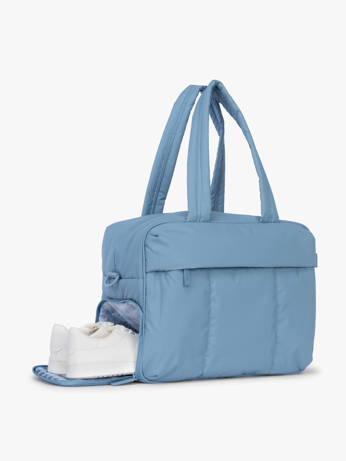 Shoe compartment of CALPAK Luka Duffel in light blue French Blue; DSM1901-FRENCH-BLUE