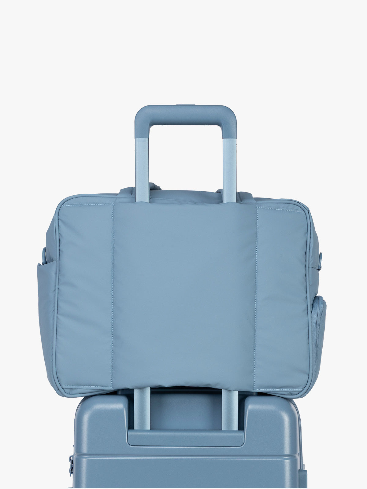 Luggage trolley sleeve of CALPAK Luka Duffel in light blue French Blue; DSM1901-FRENCH-BLUE