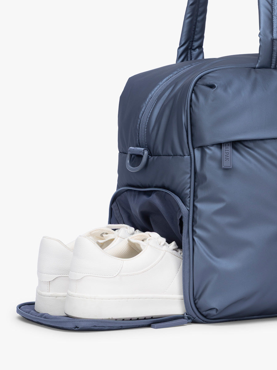 Shoe compartment of CALPAK Luka Duffel in metallic dark blue material Metallic Indigo; DSM1901-METALLIC-INDIGO