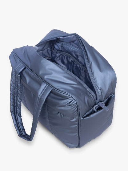 Opened view of CALPAK Luka Duffel in metallic dark blue material Metallic Indigo; DSM1901-METALLIC-INDIGO