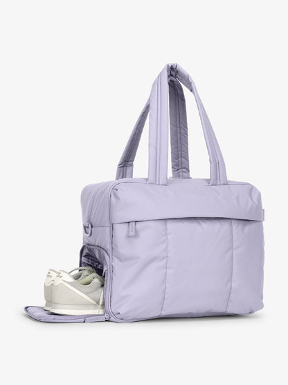 CALPAK Luka Duffel side shoe compartment shown in purple lavender Orchid; DSM1901-ORCHID