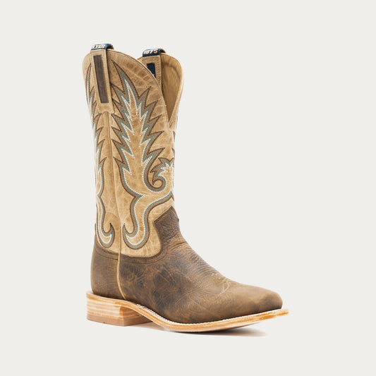 Brown and tan cowboy boot with intricate white embroidery on a light gray background