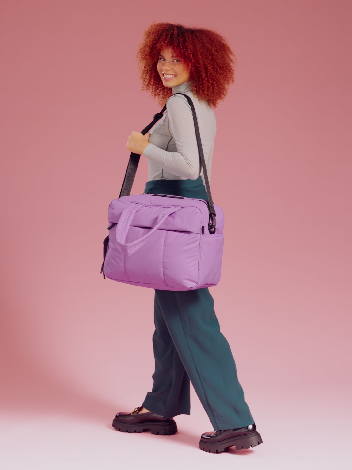 Model wearing Luka Duffel in lavender lilac over should with removable strap; DSM1901-LILAC