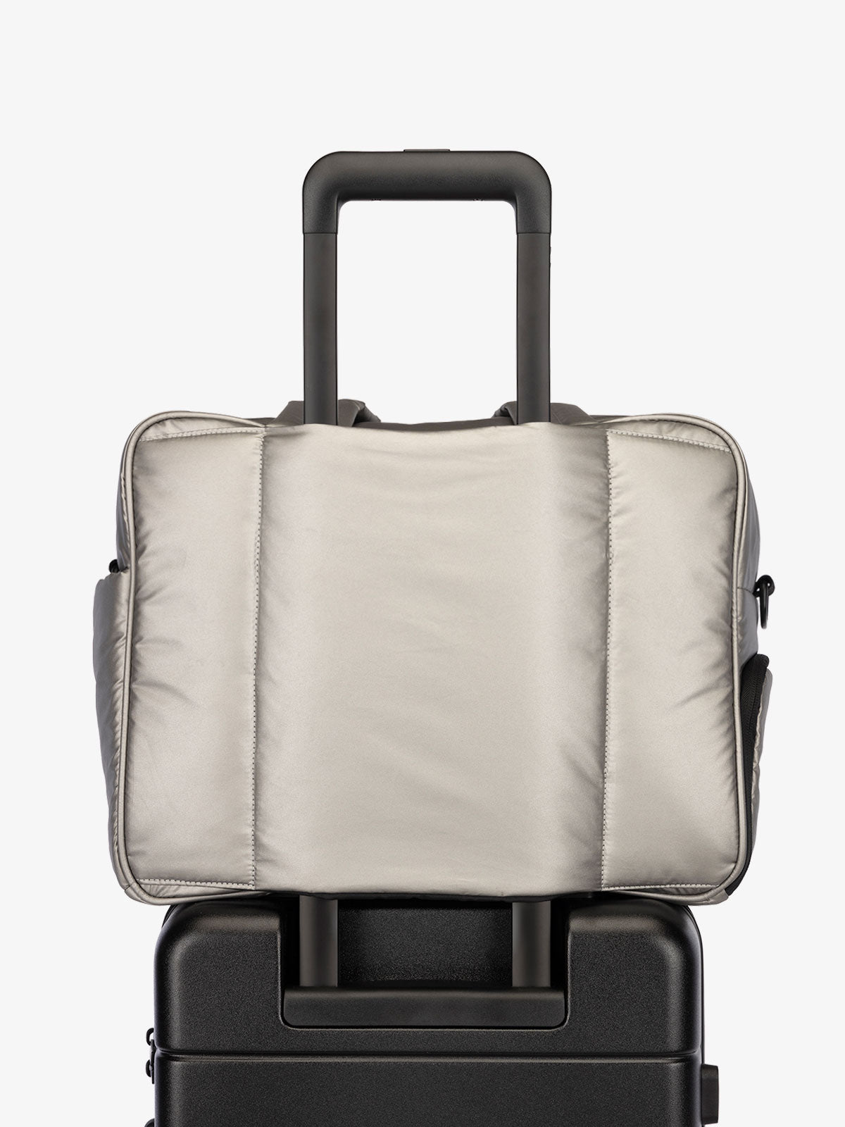 CALPAK Luka Duffel bag with luggage trolley sleeve in metallic gray; DSM1901-GUNMETAL