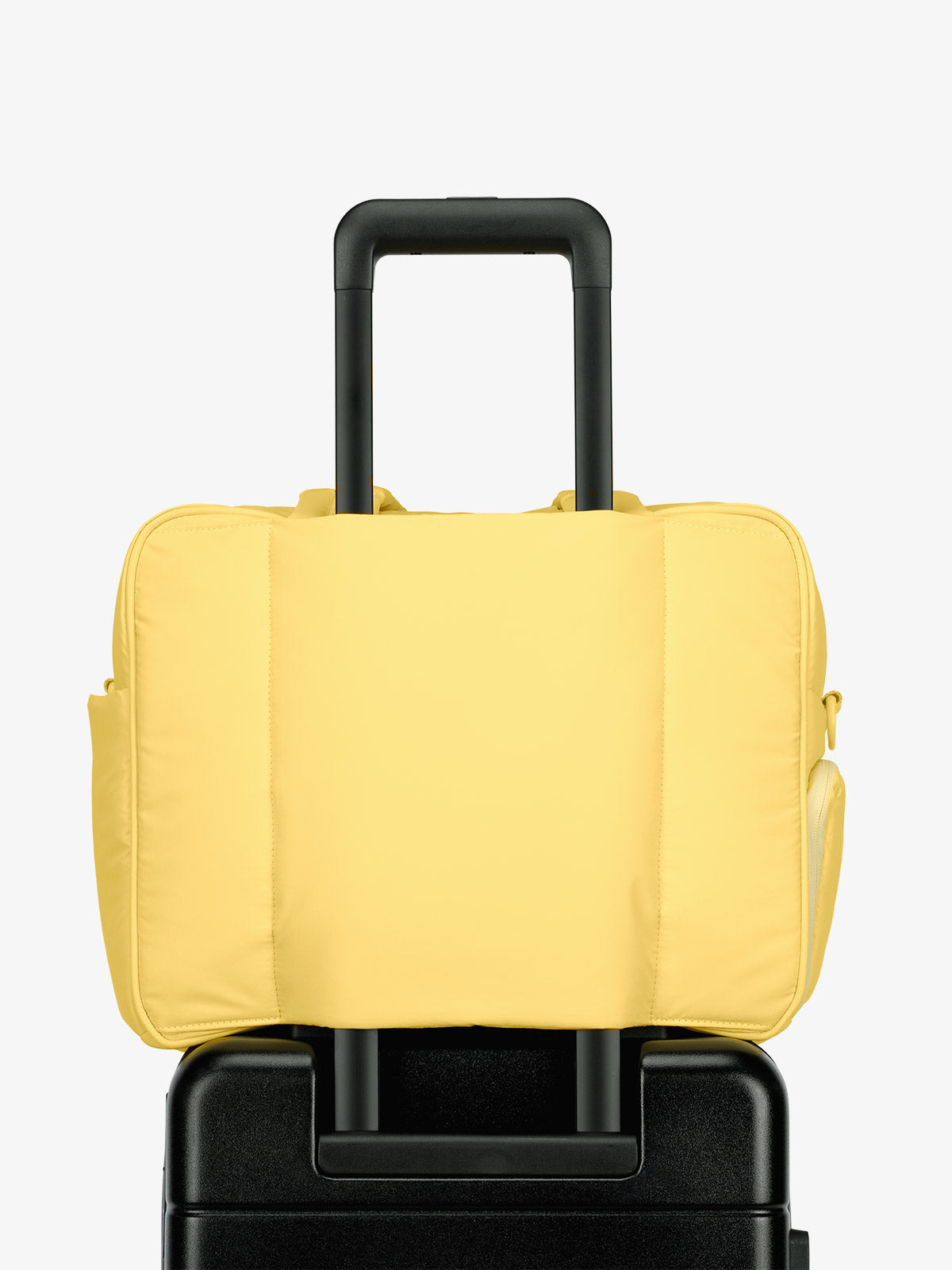 CALPAK Luka Duffel bag with luggage trolley sleeve in yellow butter; DSM1901-BUTTER