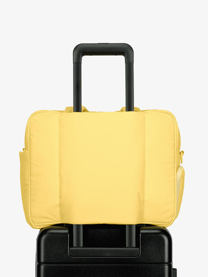 CALPAK Luka Duffel bag with luggage trolley sleeve in yellow butter; DSM1901-BUTTER