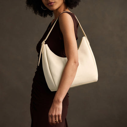 Pebbled Bone*Medium | U-shaped, flat-bottomed leather shoulder bag with adjustable strap