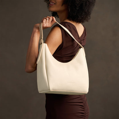 Pebbled Bone*Medium | U-shaped, flat-bottomed leather shoulder bag with adjustable strap