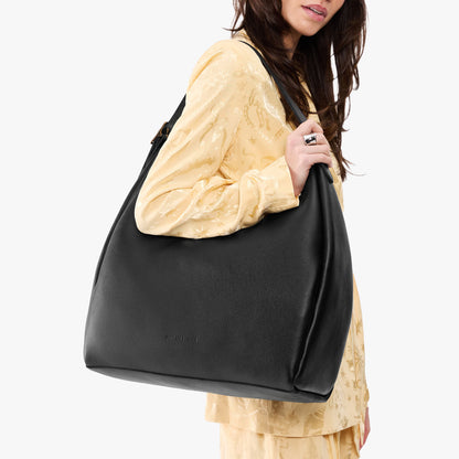 Pebbled--black*Oversized | U-shaped, flat-bottomed leather shoulder bag with adjustable strap