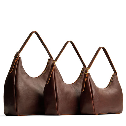 Coldbrew | Size comparison image of oversized, large, and medium u-shaped, flat-bottomed leather shoulder bags with adjustable strap